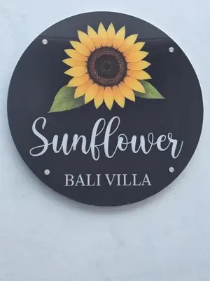 a sunflower sign with a sunflower on it at Sunflower Bali Villa 3BR Legian Double Six Beach in Seminyak