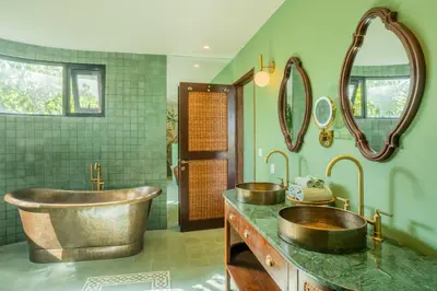 a bathroom with two sinks and a large tub at Dreamtime House Bali in Canggu