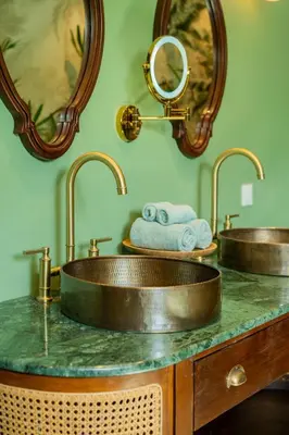a bathroom with two sinks and two mirrors at Dreamtime House Bali in Canggu
