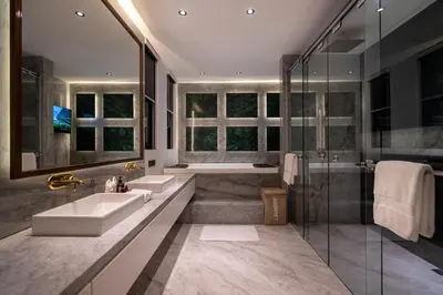 a bathroom with two sinks and a shower at House of Light 5bed villa in Canggu