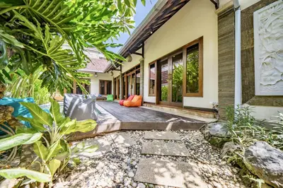 an external view of a house with plants at Seminyak Happy Villa in Legian