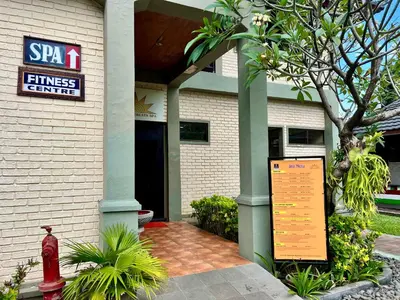 a fitness center with a sign in front of a building at Apartment at Jayakarta Residence Beach Front Access in Seminyak