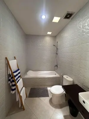 a bathroom with a tub and a toilet and a sink at Villa Majegau 3, 3 bedrooms, Seminyak center in Seminyak