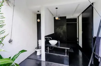 a black and white bathroom with a sink and a toilet at Villa with 2 Bedrooms & Private Bathrooms near to the beach Seminyak in Seminyak