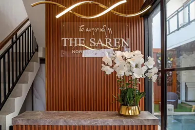 a vase of flowers on a table in front of a store at The Saren CoLiving by SooBali in Kerobokan