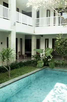 a swimming pool in front of a building at Bali Bliss Residence in Seminyak