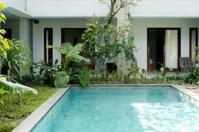 a swimming pool in the yard of a house at Bali Bliss Residence in Seminyak