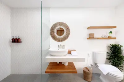 a bathroom with a sink and a toilet at Summer Cinta Seminyak in Seminyak
