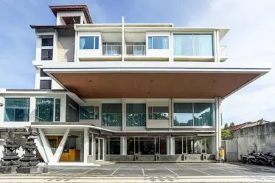 a large building with a large amount of windows at Dancenter Premium Legian Hotel in Balian