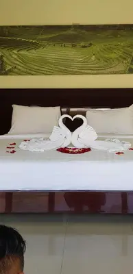 a bed with a heart on top of it at Privat Pool Villa with Kitchen at seminyak in Seminyak