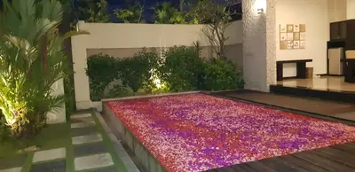 a pool of colored gravel in the middle of a garden at Privat Pool Villa with Kitchen at seminyak in Seminyak