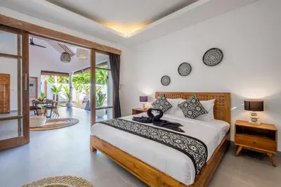 a bedroom with a large bed in a room at Harmony Villa Two Bedroom in Canggu