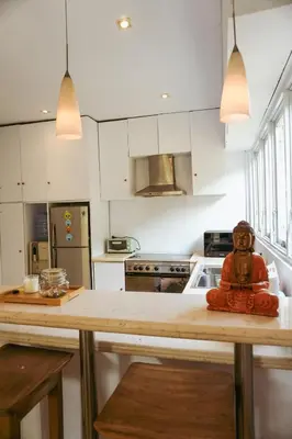 a kitchen with a figurine sitting on a counter at Villa Frankie in Central Legian in Legian