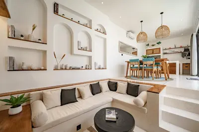 a living room with a couch and a table at Soft Opening! Villa Lumière 1 Seminyak in Seminyak