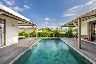 an image of a swimming pool in a house at Villa Rice - Amazing Rice-Field VIEW 3BR Villa 9px Next To Canggu in Kerobokan