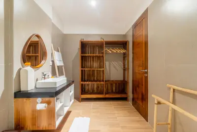 a bathroom with a sink and a mirror at Villa Bella Wilson 4 in Seminyak