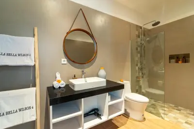 a bathroom with a sink and a mirror at Villa Bella Wilson 4 in Seminyak