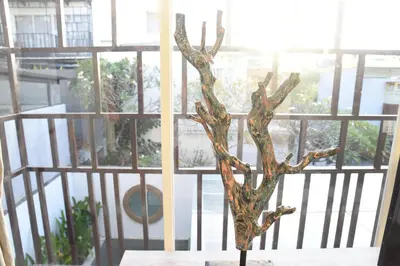 a tree ornament on a table in front of a window at Casa Nakoa 2BR With Private Pool in Nusa Dua