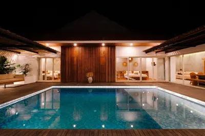 a swimming pool in the middle of a house at Anama Villa Kerobokan in Seminyak