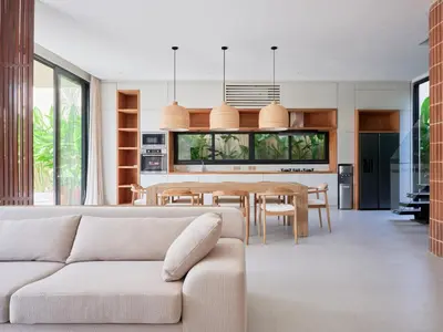 a living room with a couch and a table at Villa Papaya Luxurious4bd Umalas in Canggu