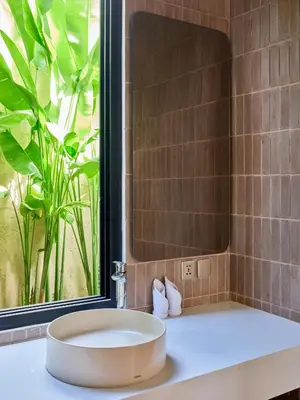 a bathroom with a sink and a large window at Villa Papaya Luxurious4bd Umalas in Canggu