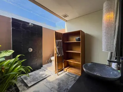 a bathroom with a sink and a shower at Luxurious 5Br Retreat in Umalas in Canggu