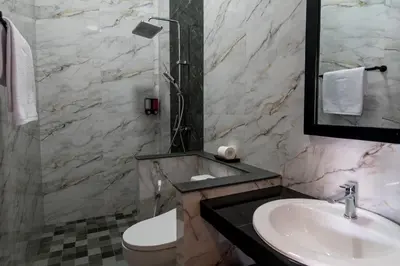 a bathroom with a sink and a toilet at Villa Sakura III Seminyak in Seminyak