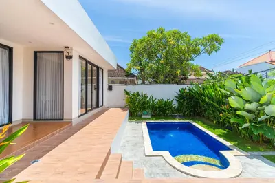 a swimming pool in the backyard of a house at Villa Litan Seminyak - 3 Bedroom Villa in Seminyak