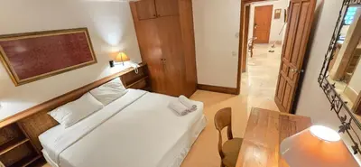 a small room with a bed and a table at The Palmana Courtyard Jayakarta Residence 4 in Seminyak
