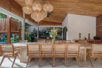 a dining room with a table and chairs at Incredible Family villa with water slide Beachside in Sanur