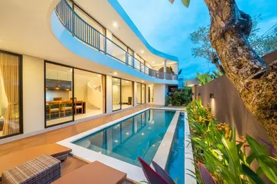 an exterior view of a house with a swimming pool at Modern 3BR Villa Private Pool Serangan Beach in Pulau Serangan