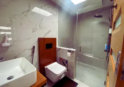 a bathroom with a sink and a toilet and a shower at Villa Casanomi By Pandara in Kerobokan