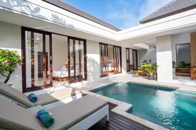 an indoor swimming pool in a villa at Vansari Serenity Villa in Seminyak
