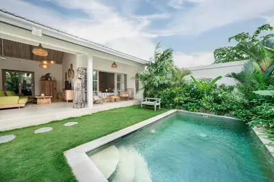 a swimming pool in the backyard of a house at Villa Anna Lou 1BR Boho Escape in Seminyak in Seminyak