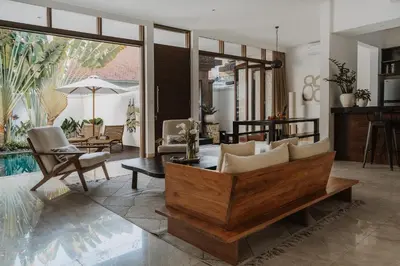a living room with a couch and a table at Villa Casa Rumi in Canggu