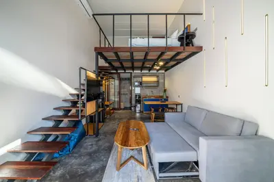 a living room with a couch and a table at First 5 Bedrooms Villa in Seminyak
