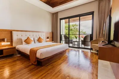 a hotel room with a bed and a large window at Villa By The Sea with private swimming pool in Benoa - Nusa Dua in Ujung
