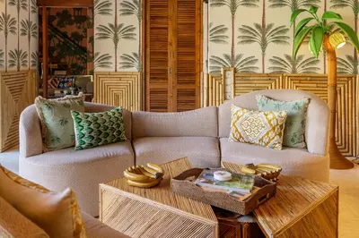 a living room with a couch and a table at Sweet Surrender - Stylish 4BR Near Potato Head in Seminyak