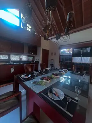 a kitchen with a table with plates and glasses on it at Ohara Hideway 3BR Japanese Vibes Villa in Kerobokan Seminyak Bali in Seminyak