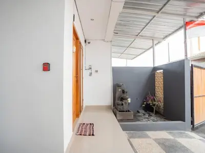 a hallway of a building with a door and a room at Town House, Modern Minimalis, Lokasi Strategis in Seminyak