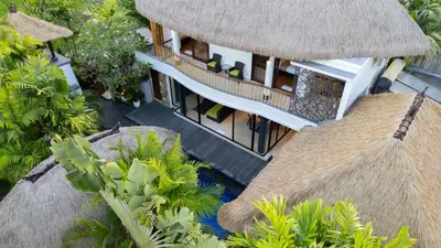 an aerial view of a resort with a building at Aragreen Berawa Villa in Canggu