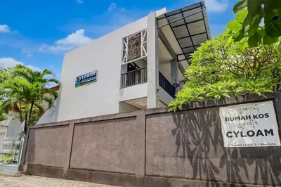 a building with a sign in front of it at Hotel O near Trans Studio Theme Park formerly Cyloam Residence in Legian