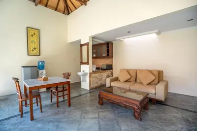 a living room with a couch and a table at Seminyak Classic 1BRoom Private Pool Villa in Seminyak