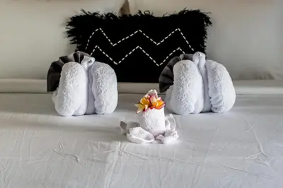 a group of four stuffed animals on a bed at Villa Sakura ll seminyak in Seminyak