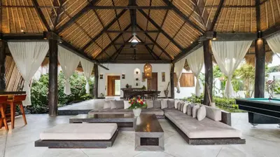 a living room with a pool table in a villa at Villa Bidadari With Pool in Seminyak