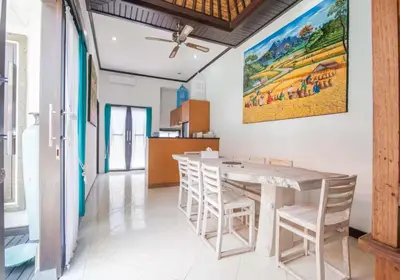 a dining room with a table and chairs at Villa Marjens 2 Seminyak area Bali in Kerobokan