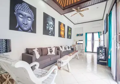 a living room with a couch and chairs in it at Villa Marjens 2 Seminyak area Bali in Kerobokan