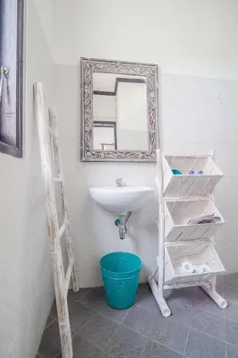 a bathroom with a sink and a mirror at Villa Marjens 2 Seminyak area Bali in Kerobokan