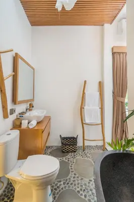 a bathroom with a toilet and a sink at NaraDama Villa Seminyak Bali in Seminyak