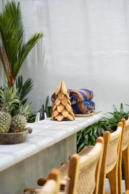 a table with a plate of food on it at NaraDama Villa Seminyak Bali in Seminyak